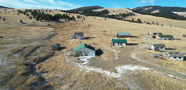 drone / aerial view featuring a mountain view and a rural view