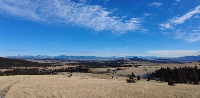 property view of mountains featuring a rural view