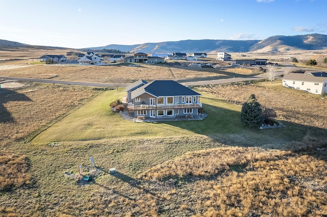 birds eye view of property with a mountain view