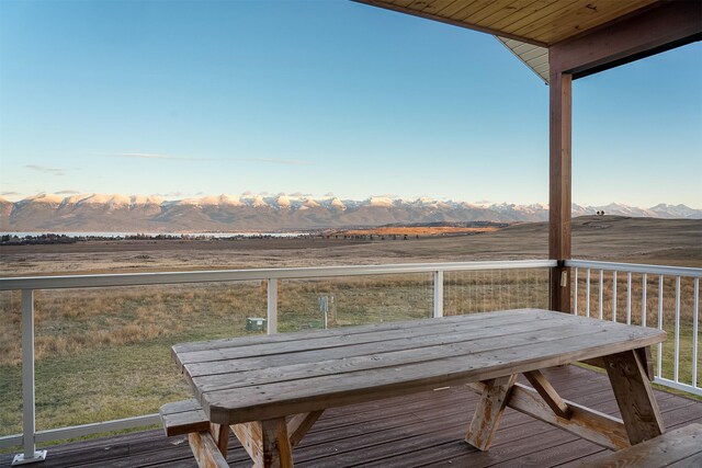 wooden terrace with a mountain view and a rural view