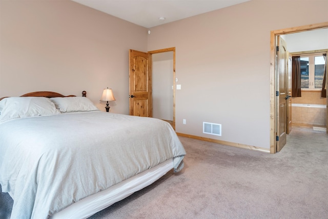 bedroom with light colored carpet