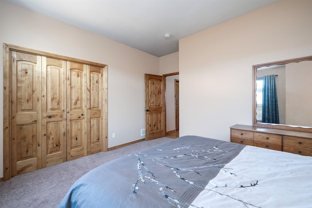 carpeted bedroom with a closet