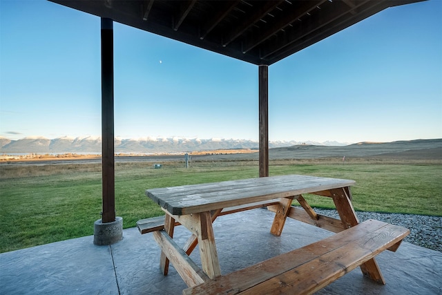 view of patio featuring a mountain view and a rural view