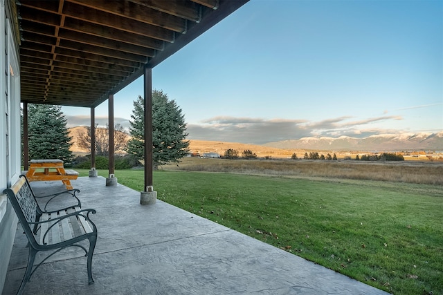 view of patio featuring a mountain view and a rural view