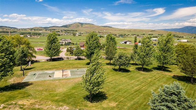 birds eye view of property featuring a mountain view and a rural view