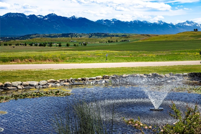 view of mountain feature featuring a rural view and a water view