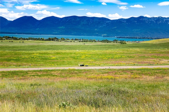 view of mountain feature featuring a water view and a rural view