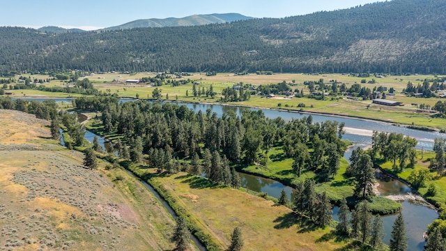 aerial view featuring a water and mountain view