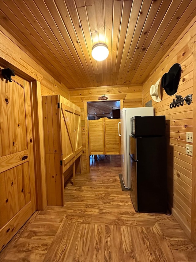 corridor featuring wood walls and wooden ceiling