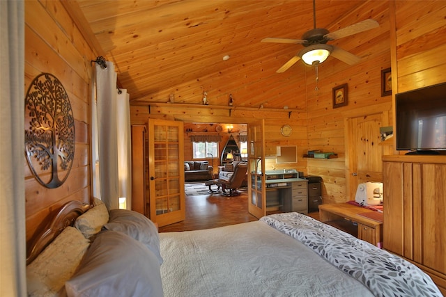 bedroom featuring lofted ceiling, wood walls, and wood ceiling