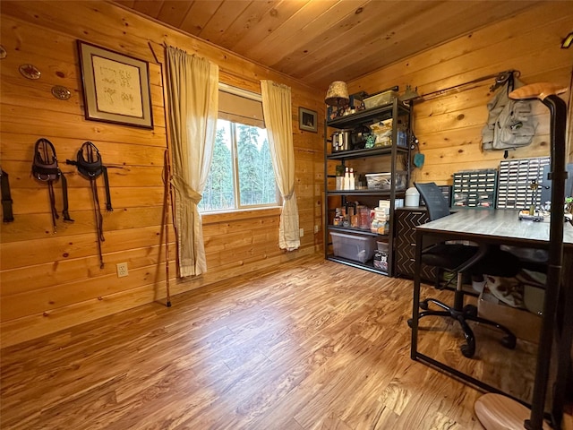 home office with wooden ceiling, hardwood / wood-style floors, and wooden walls