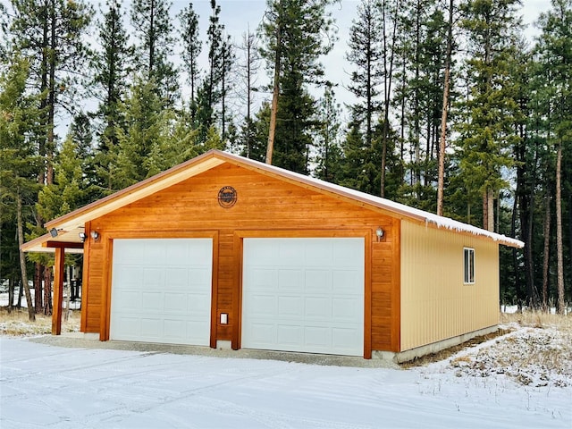 view of snow covered garage