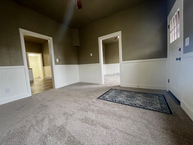 carpeted empty room with ceiling fan