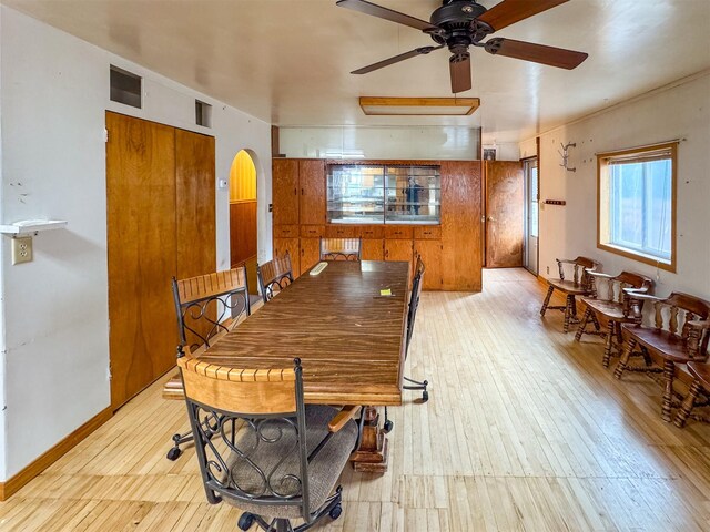 dining room featuring light wood-type flooring and ceiling fan