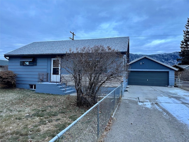 view of front of house with an outbuilding and a garage