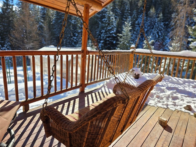 view of snow covered deck