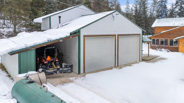 view of snow covered garage