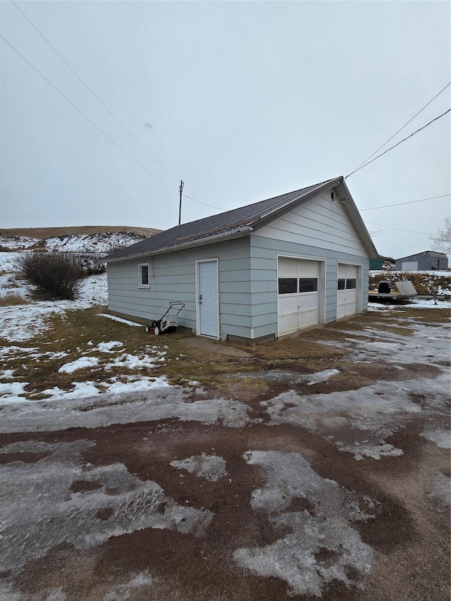 view of snow covered garage