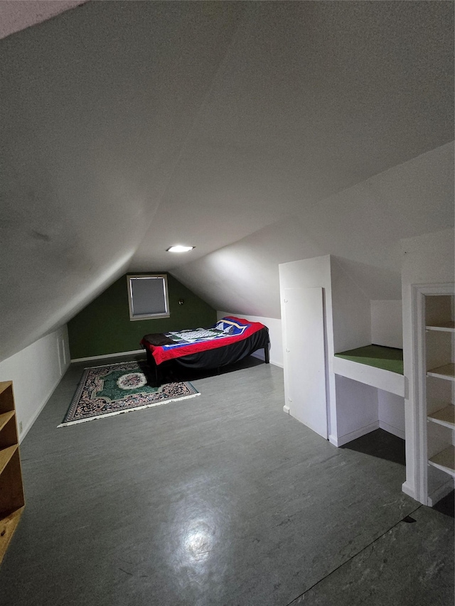 additional living space featuring vaulted ceiling