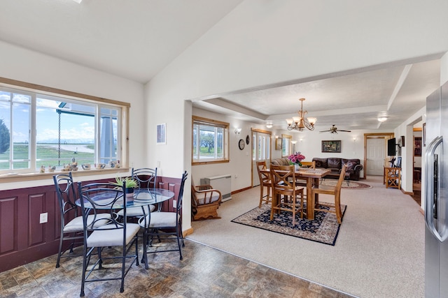 358 Hamilton Heights Rd, Corvallis, MT 59828 - dining space featuring a raised ceiling, baseboards, stone finish flooring, and a chandelier