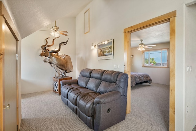 bedroom featuring carpet flooring, ceiling fan, and a textured ceiling