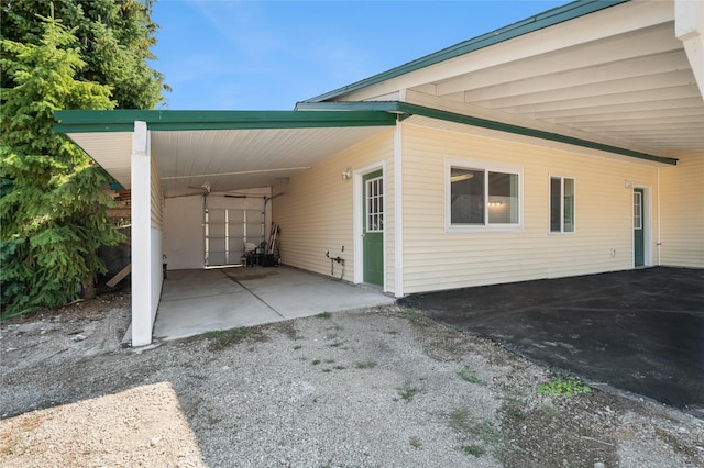 view of side of home with a carport