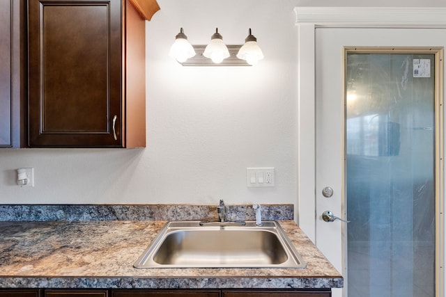 358 Hamilton Heights Rd, Corvallis, MT 59828 - room details featuring a sink and dark brown cabinetry