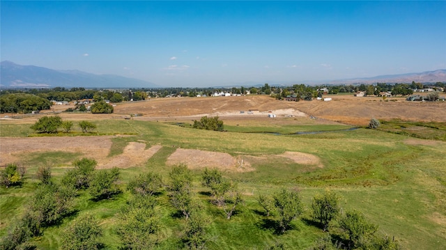 drone / aerial view featuring a mountain view and a rural view