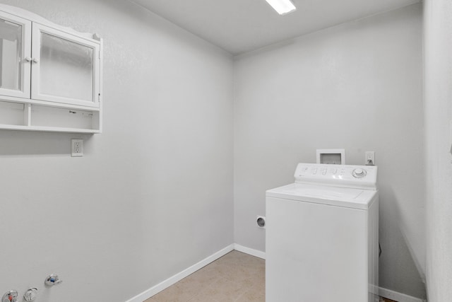 358 Hamilton Heights Rd, Corvallis, MT 59828 - washroom featuring washer / dryer, baseboards, and cabinet space