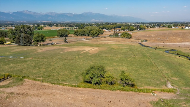 drone / aerial view with a mountain view and a rural view