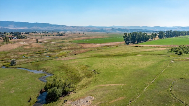 birds eye view of property with a mountain view and a rural view