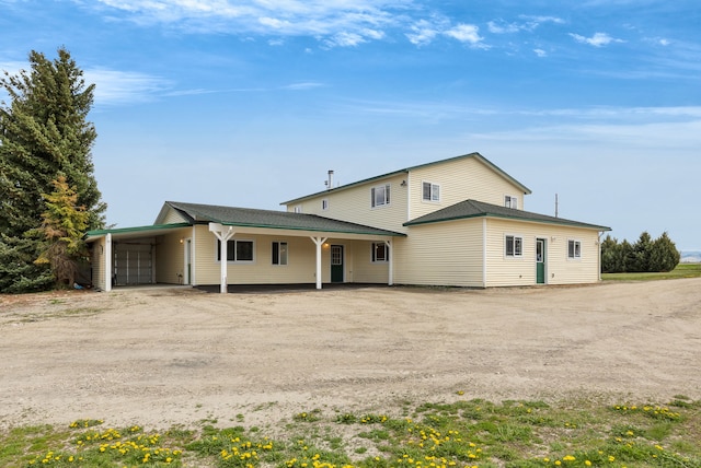 358 Hamilton Heights Rd, Corvallis, MT 59828 - view of front facade featuring driveway and an attached carport