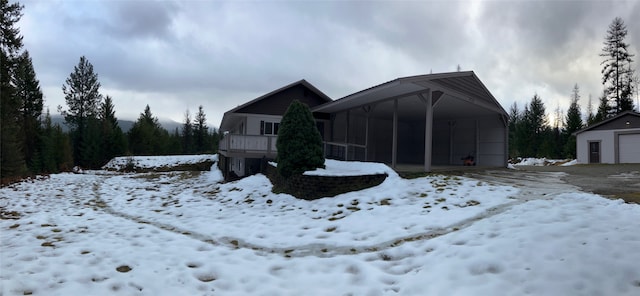 exterior space with a carport and a garage