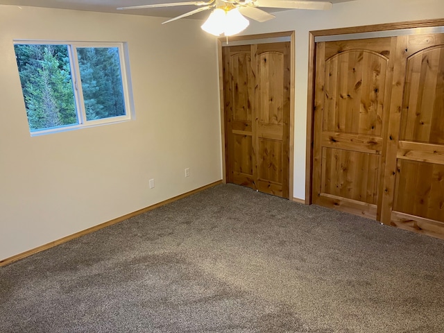 unfurnished bedroom with ceiling fan and carpet flooring