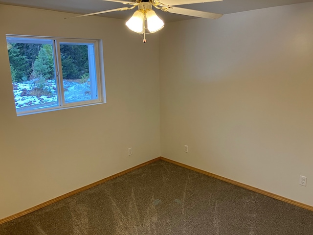 carpeted empty room with ceiling fan