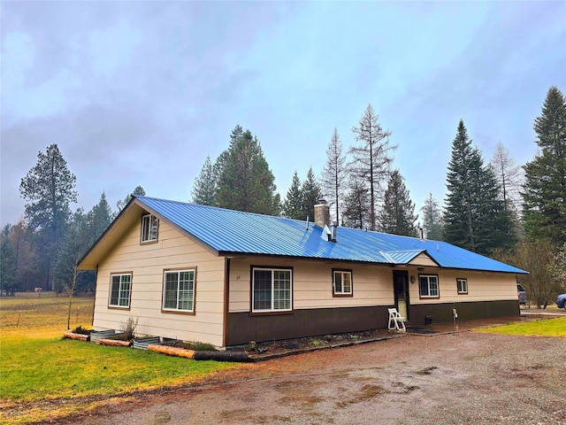 rear view of property with a yard