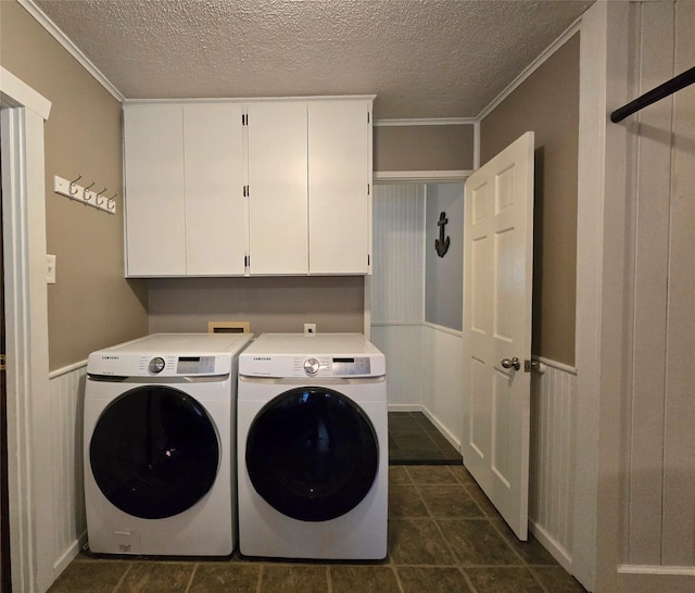 98 Railroad Ave, Heron, MT 59844 - laundry room with cabinet space, washing machine and clothes dryer, a wainscoted wall, ornamental molding, and a textured ceiling