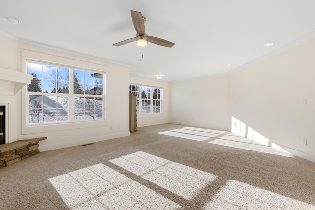 unfurnished living room with light colored carpet, ceiling fan, and crown molding