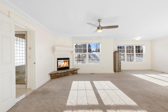 unfurnished living room featuring light carpet, ceiling fan, and crown molding