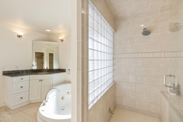 bathroom with tile patterned floors, vanity, separate shower and tub, and lofted ceiling