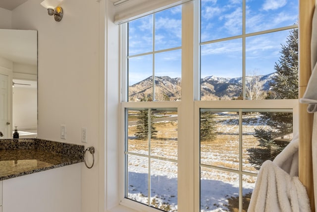 interior space featuring a mountain view and vanity