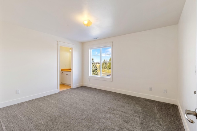 spare room featuring carpet floors