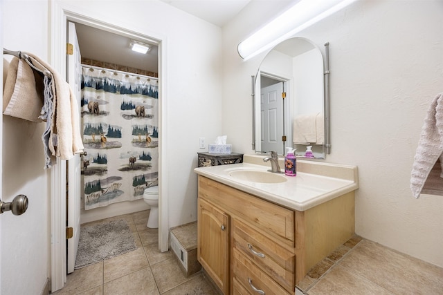 bathroom with tile patterned floors, vanity, toilet, and a shower with curtain