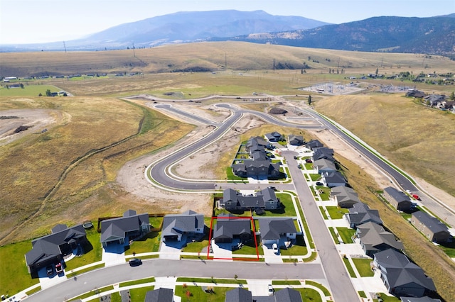 birds eye view of property featuring a mountain view