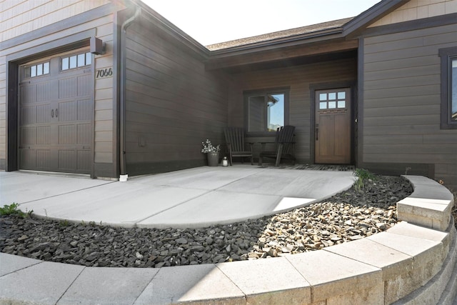 doorway to property featuring a garage