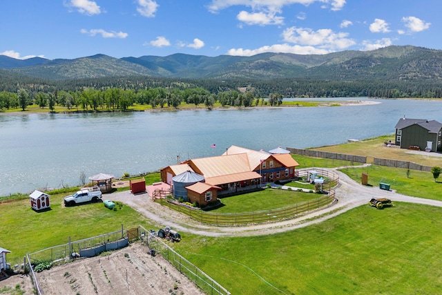 birds eye view of property featuring a water and mountain view