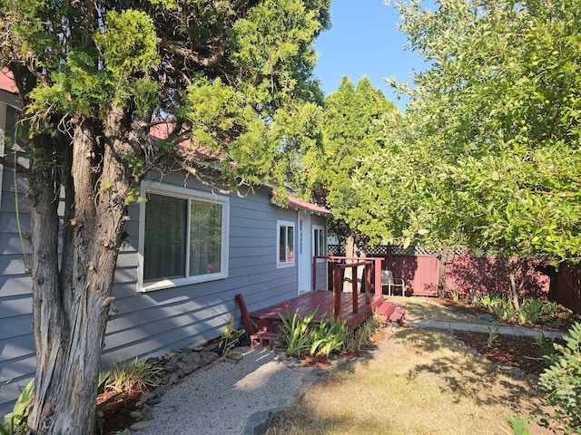 view of yard featuring a wooden deck