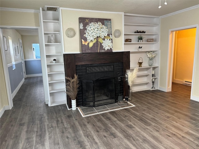 living room featuring built in shelves, dark hardwood / wood-style floors, a baseboard radiator, and crown molding