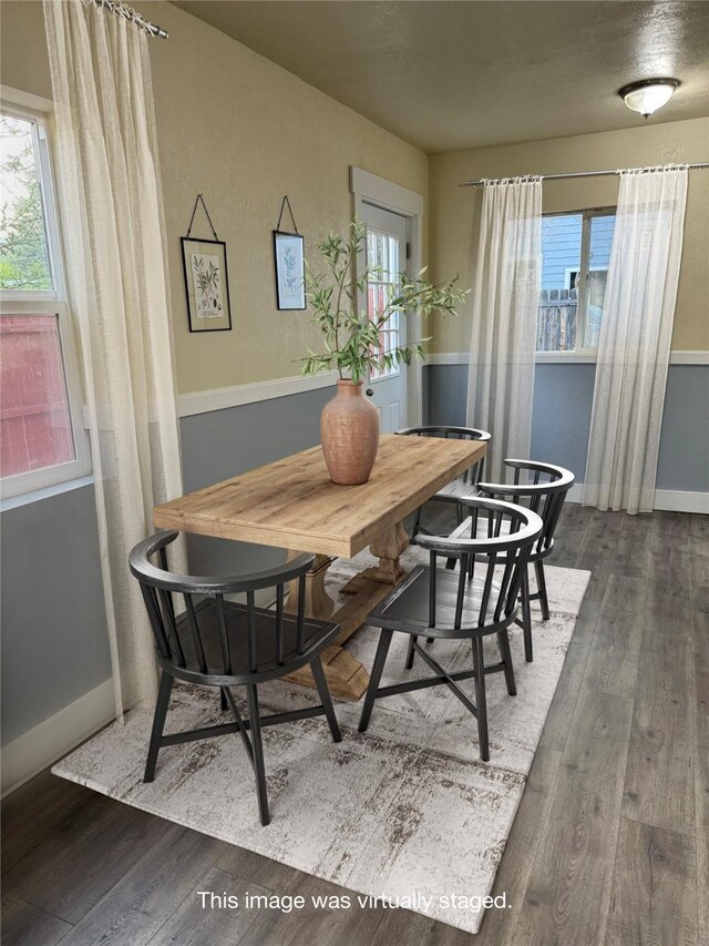 dining space featuring dark hardwood / wood-style flooring