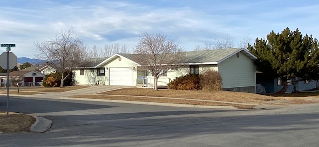 ranch-style home featuring a garage